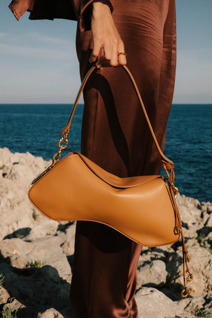  Deià handmade Nappa Leather Shoulder bag with Hanging Organic Rings senderkis caramel front view